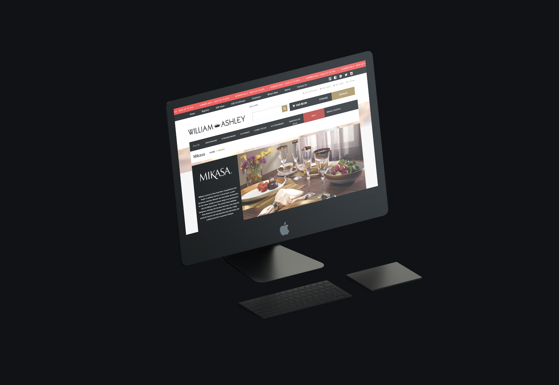 image of desktop computer on a black background featuring the William Ashley website